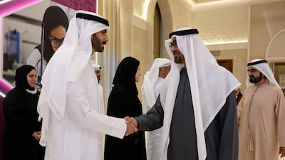 Sheikh Mohamed shakes hands with Salem Al Qassimi, Minister of Culture and Youth