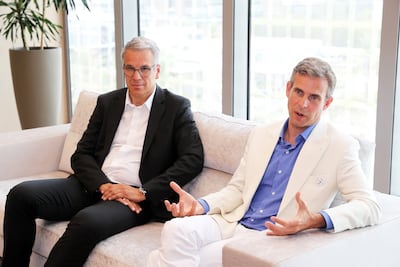 EOS executive Markus Glasser, left, and Hyperganic chief executive Lin Kayser. Pawan Singh / The National