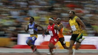 Mike Rodgers, centre, of the US and Usain Bolt of Jamaica compete in the men’s 100-metre heats on Saturday at the World Championships in Athletics. Phil Noble / Reuters