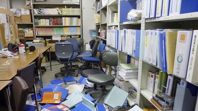 File folders are seen scattered on the floor of the Kyodo News bureau after a strong quake in Sendai, Miyagi Prefecture, Japan, on February 13, 2021. REUTERS