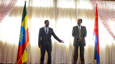 Ethiopian Prime Minister Abiy Ahmed (L) and President Isaias Afeworki of Eritrea celebrate the reopening of the Embassy of Eritrea in Ethiopia. AFP