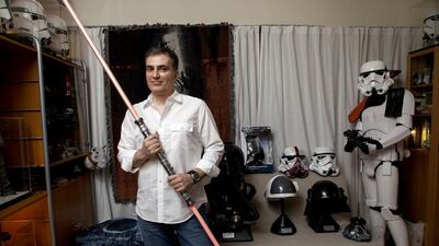 Omar Al Bahiti with some of his Star Wars memorabilia at his home in Dubai. Christopher Pike / The National