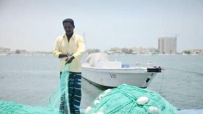 While most people in Umm Al Quwain relax during Ramadan, some fishermen are still at work on the emirate's creek. Lee Hoagland/The National