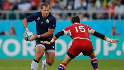 Scotland's flanker Fraser Brown (L) looks to pass past Russia's full back Vasily Artemyev during the Japan 2019 Rugby World Cup Pool A match between Scotland and Russia at the Shizuoka Stadium Ecopa in Shizuoka. AFP