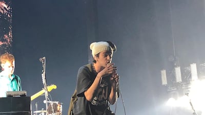 Matty Healy appeared wearing a knitted hat, which he quickly threw into the crowd. Sophie Prideaux / The National