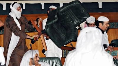 Dozens of anti-government protesters fored their way into Kuwait's parliament during a debate over efforts to call the prime minister for questioning over corruption allegations Wednesday night.