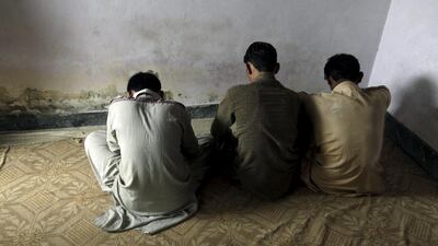 Children whose families say have been abused, turn their backs to the camera while they are interviewed in their village of Husain Khan Wala, Punjab province, Pakistan. Mohsin Raza / Reuters