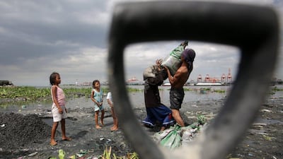 Filipinos carry sandbags as they reinforce a dike in preparation for a super typhoon that threatens to enter the country within the next 48 hours. Francis R Malasig / EPA