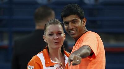 Indian Aces players Agnieszka Radwanska (L) and Rohan Bopanna (R) chat during the International Premier Tennis League (IPTL) at Dubai Duty Free Tennis Stadium in Dubai, United Arab Emirates, 14 December 2015. EPA/ALI HAIDER