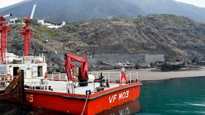 A firefighters' boat docks at the village of Ginostra, on the small Sicilian island of Stromboli, southern Italy, a day after the Stromboli volcano, seen in the background, erupted. Civil protection authorities said a hiker was killed during the eruptions on Wednesday which sent about 30 tourists jumping into the sea for safety. AP