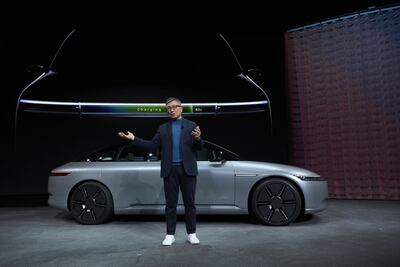 Yasuhide Mizuno, chairman and chief executive officer of Sony Honda Mobility, speaks in front of an Afeela prototype during a press event at CES. Bloomberg