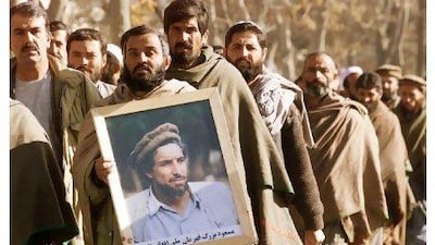 Ahmad Shah Masoud's supporters pay tribute to him a month after suspected Al Qaeda operatives had him assassinated. Jimin Lai / AFP