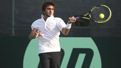 The UAE's Hamad Janahi defeated Cambodian player Panhara Mam, who was forced to retire due to cramping, in their Davis Cup qualifier match at Dubai on Thursday. Razan Alzayani / The National