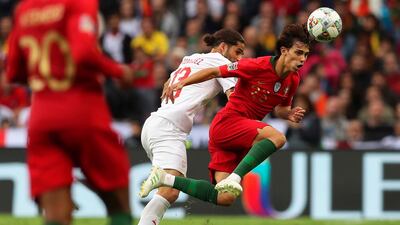 Switzerland's Ricardo Rodriguez (C) in action against Portugal's Joao Felix (R) during the UEFA Nations League semi final. EPA