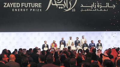Sheikh Mohammed bin Zayed, Crown Prince of Abu Dhabi and Deputy Supreme Commander of the Armed Forces, and Dr Sultan Al Jaber, Minister of State and chief executive of Adnoc, with the winners at the Sheikh Zayed Future Energy Prize. Chris Whiteoak / The National