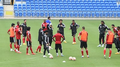 UAE coach Mahdi Ali speaks with his team during a training session at Robina Stadium in Gold Coast, Australia, on December 28, 2014. Courtesy UAE FA