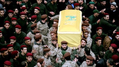 Hizbollah fighters carry the coffin of slain commander, Imad Mughniyeh, during his funeral in the southern suburbs of Beirut on February 14, 2008. Mazen Akl/AFP Photo