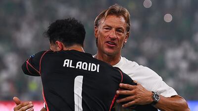 Saudi Arabia's goalkeeper Nawaf Al Aqidi, left, and head coach Herve Renard celebrate at the end of the 0-0 draw with Iraq. AP
