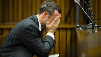 Oscar Pistorius, cradles his head in his hands in court on the fifth day of his trial at the high court in Pretoria, South Africa. (Theana Breugem / AP Photo / March 7, 2014)