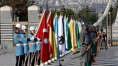 Members of military honour guard in historical costumes and holding 16 flags of old Turkish states wait for a welcome ceremony for Iraqi Prime Minister Adel Abdul-Mahdi, in Ankara, Turkey. AP Photo