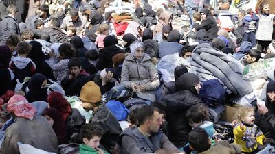 Syrian civilians at a school in Adra district on outskirts of Damascus on March 16, 2018. Louia Beshara / AFP