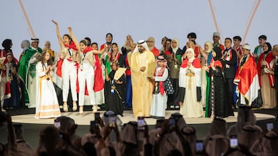 Sheikh Mohammed bin Rashid, Vice President and Ruler of Dubai, with the joint winners of the Arab Reading Challenge, twin sisters Baisan and Baylsan Koka, at Dubai World Trade Centre. Ruel Pableo for The National