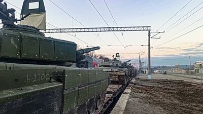 Russian armoured vehicles are loaded on to railway platforms after the end of military drills in southern Russia. AP Photo