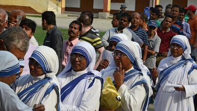 Indian voters queue up to cast their vote at a polling station in Siliguri, West Bengal. AFP