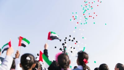 13. BALLOONS: Balloons in the colours of the UAE flag are launched into the Fujairah skies as part of the emirate's National day celebrations. Reem Mohamed / The National