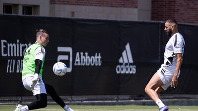 Karim Benzema attempts to finish past Andriy Lunin at Real's training session in LA. EPA