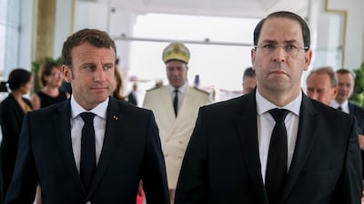 Tunisian Prime Minister Youssef Chahed, right, welcomes French President Emmanuel Macron who attended the funeral ceremony for the country’s first democratically elected president Beji Caid Essebsi. AP