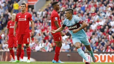 Manuel Lanzini celebrates after scoring the first goal for West Ham. against Liverpool. Carl Recine / Reuters