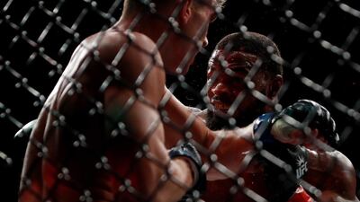 Tyron Woodley of the United States, right, fights against Stephen Thompson of the United States in their welterweight championship bout. Woodley thought he had seen off Thompson to claim a narrow split decision, but the result initially announced in the octagon was corrected after several minutes and changed to a majority draw. . Michael Reaves / Getty Images