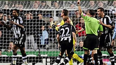 Habib Beye, left, sees red but it was proved that he did touch the ball when he challenged Robinho.