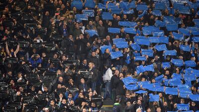 Inter Milan fans hold up banners before the match. Reuters