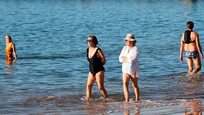 People paddle on the shores of the Atlantic ocean in Saint Jean de Luz, south-west France. France's health minister says the country is 'progressively getting back in control' of its resurgent epidemic. AP Photo