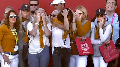 European players’ wives react after a missed putt by Lee Westwood on the 18th hole during the afternoon foursomes. Carlos Gonzalez / AP Photo