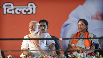 Indian prime minister Narendra Modi and finance minister Nirmala Sitharaman. The country's debt plan has boosted bonds. AP