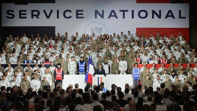 Mr Macron delivers a speech unveiling the new national service, at a military base in Varces. AFP