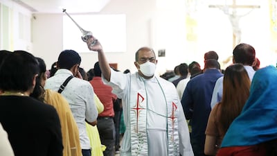 Father Lennie Connully during the Easter Sunday mass held at St. Mary's Catholic Church in Dubai. Pawan Singh / The National