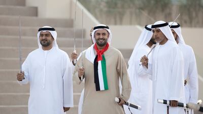 Sheikh Mohamed bin Hamad Al Nahyan, private affairs adviser in the Presidential Court, takes part in a traditional dance with Maj Gen Sheikh Ahmed bin Tahnoon Al Nahyan, chairman of the UAE National and Reserve Service Authority. Mohamed Al Hammadi / Presidential Court