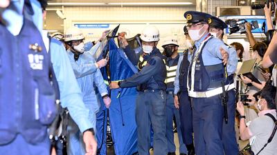 A man with a knife injured 10 passengers on a commuter train in Tokyo. AP