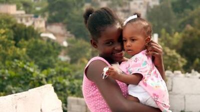 Mendji Bahina Sanon, aka Fedora, a 12-year-old schoolgirl who survived nine days under rubble, playing with a neighbour´s child at her home in Petionville, a leafy suburb of Port-au-Prince.