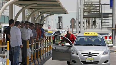 Some people wait their turn at taxi stands while others just barge in. Jaime Puebla / The National