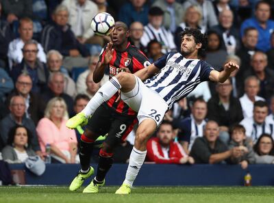 Ahmed El-Sayed Hegazi of West Bromwich Albion, right, clears from Benik Afobe of Bournemouth. David Rogers / Getty Images
