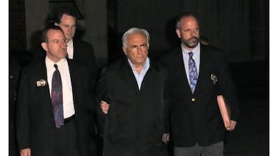Dominique Strauss-Kahn, managing director of the International Monetary Fund, second right, has been charged with attempted rape and a criminal sex act on a New York hotel maid. Peter Foley / Bloomberg