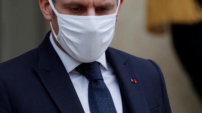 French President Emmanuel Macron, wearing a protective face mask. Reuters