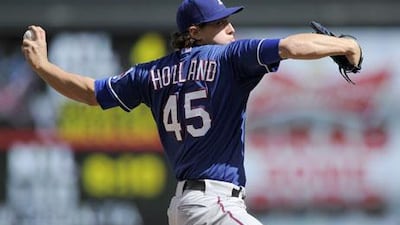 Derek Holland pitched impressively against the Minnesota Twins. Hannah Foslien / Getty Images / AFP