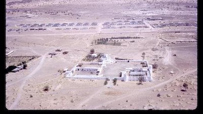 An aerial view of Al Jahili fort, with Jebel Hafeet in the distance