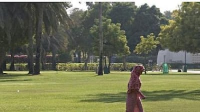 A woman on her way to meet with friends in Al Safa Park in the Al Wasl neighborhood in Dubai.